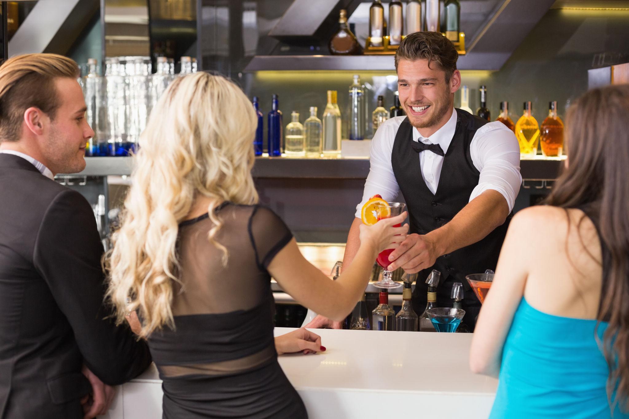 Bartender serving guests